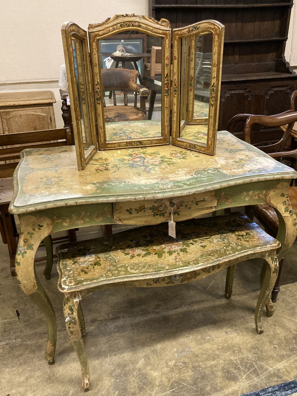 An early 20th century Venetian style rectangular floral painted serpentine table with similar triple dressing table and a low occasiona